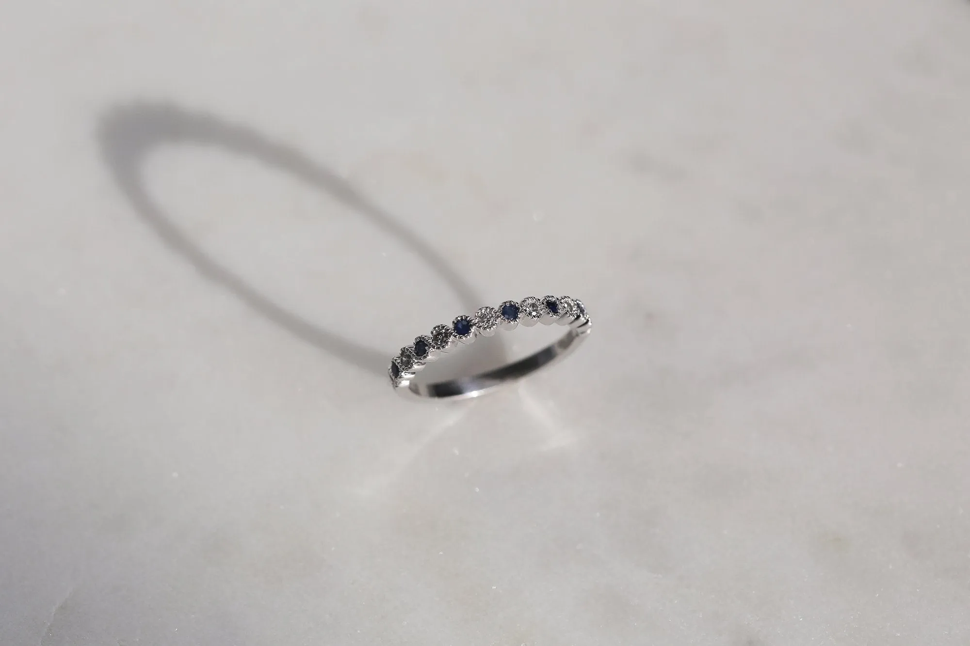 Alternating Diamond and Sapphire Milgrain Band