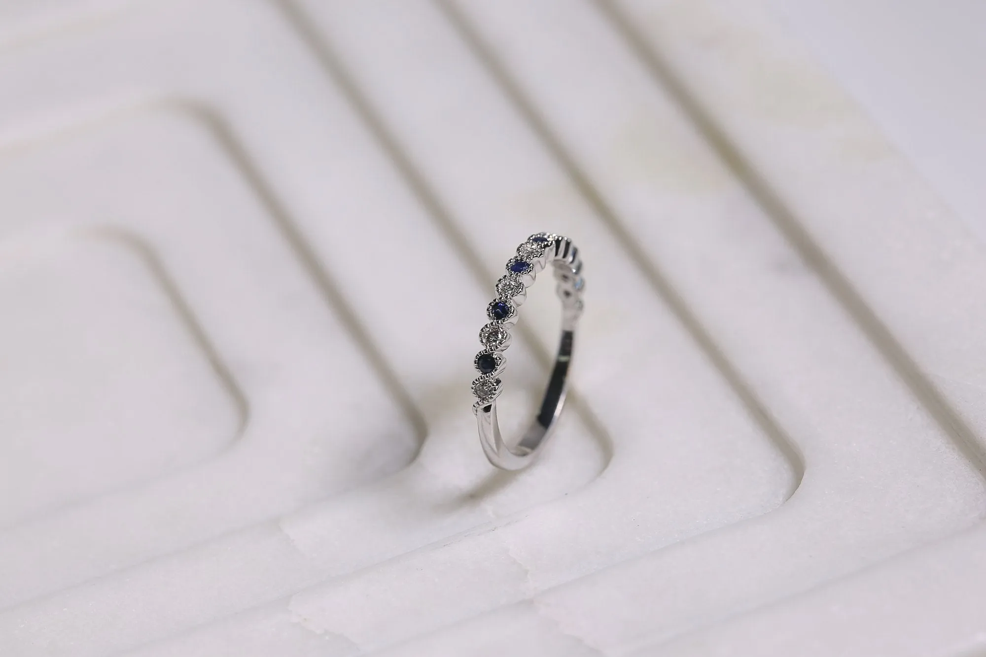 Alternating Diamond and Sapphire Milgrain Band