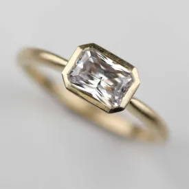 Emerald Cut East-West Bezel Solitaire Engagement Ring