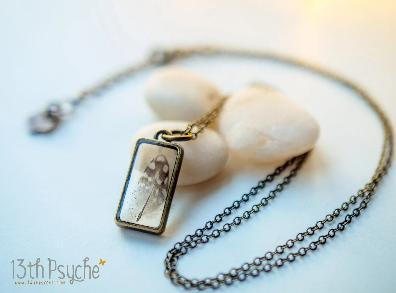 Square shaped resin pendant with real tiny feather necklace